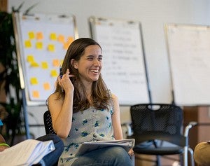 Female student smiling during class. Female student smiling during class.