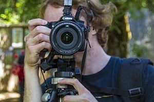 Person taking photograph with Canon camera. Person taking photograph with Canon camera.