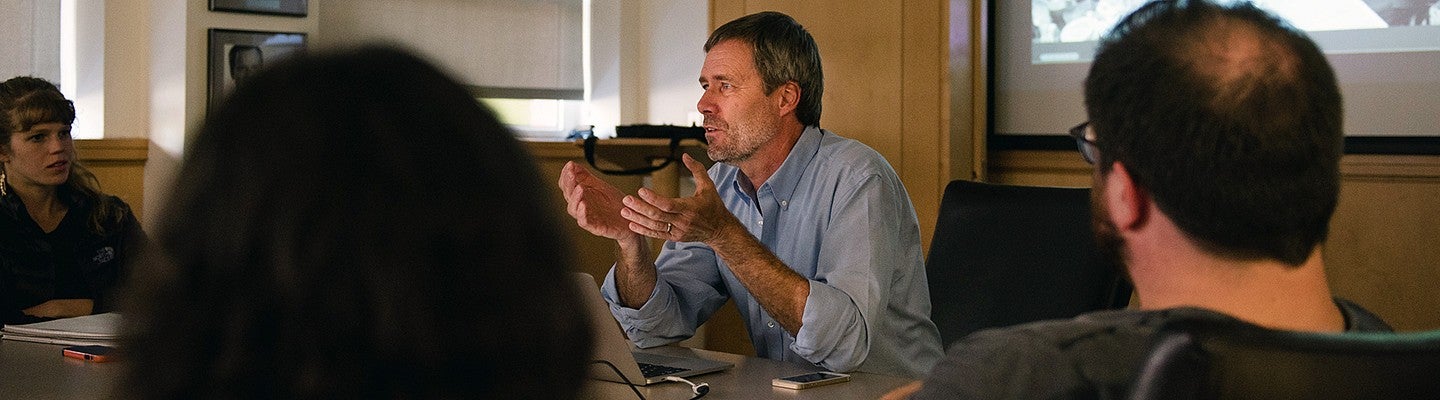 male professor leads discussion