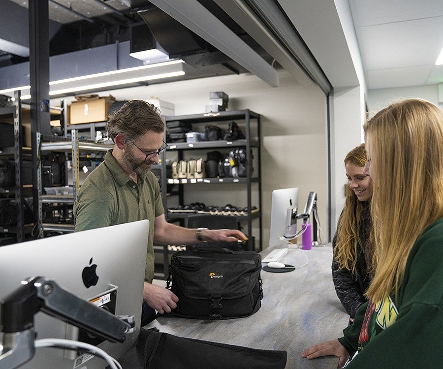 students check out camera equipment from the Allen Hall J-Cage students check out camera equipment from the Allen Hall J-Cage