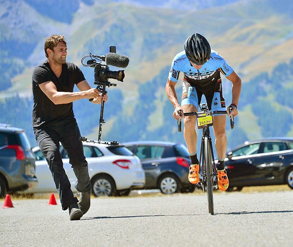 Jake Swantko filming a cyclist