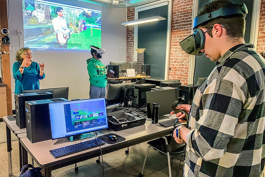 students and a professor using VR gear in the Oregon Reality Lab