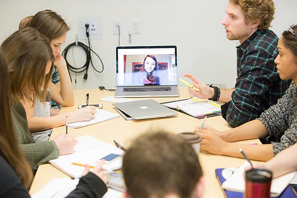 Group of students sitting around a table