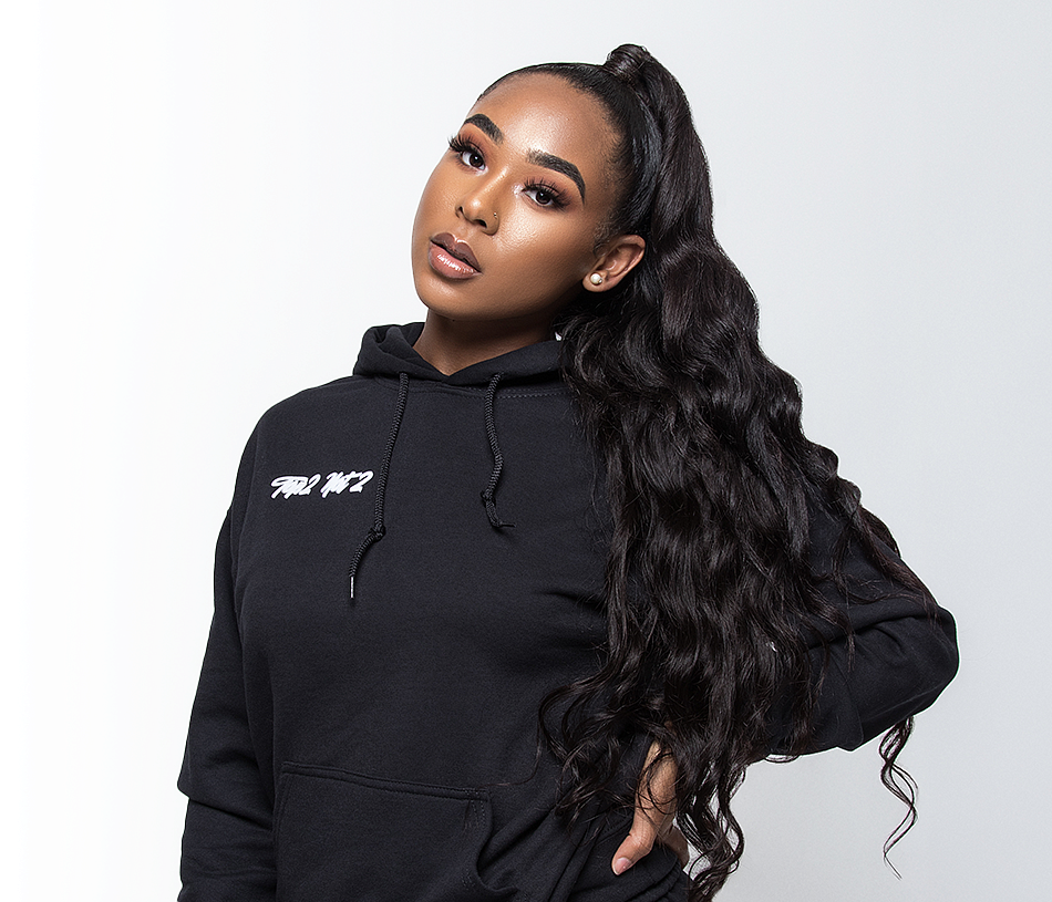 Minyon Moore Minyon Moore with a long ponytail in a black hoodie