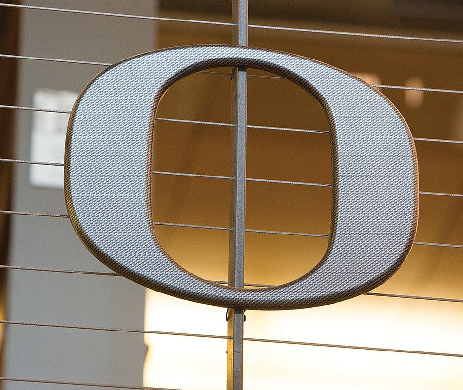 a metal version of the Oregon O logo as seen on the Allen Hall stairs