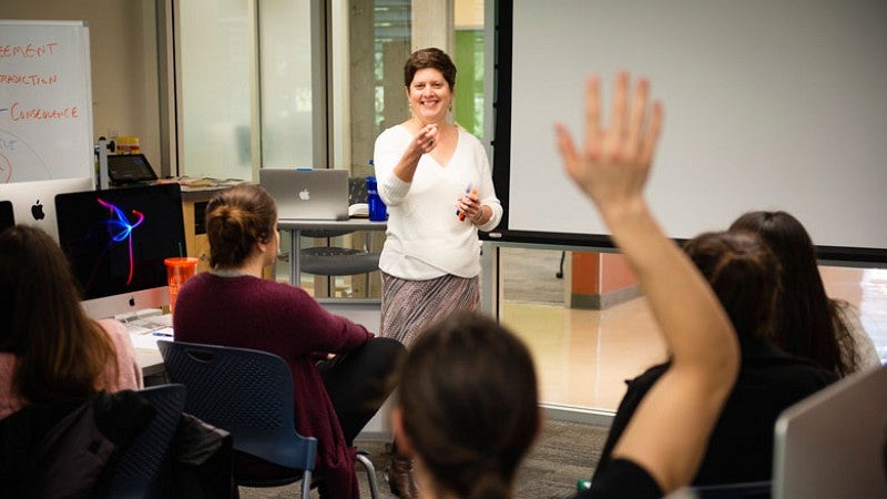 Shontz is a student favorite in the classroom, where she is known affectionately as “Mama Lori” thanks to her enthusiastic personality and dedication to mentoring students. Lori Shontz teaching during class at the School of Journalism and Communication