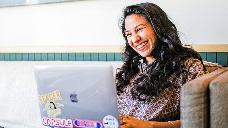 Jackie Gutierrez works on a laptop
