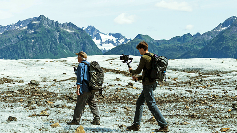An SOJC student shoots footage on the Sheridan glacier in Alaska. Photo by Haley Justus. An SOJC student shoots footage on the Sheridan glacier in Alaska
