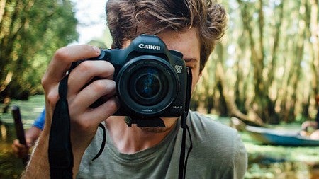 Student taking a photo with a Canon camera