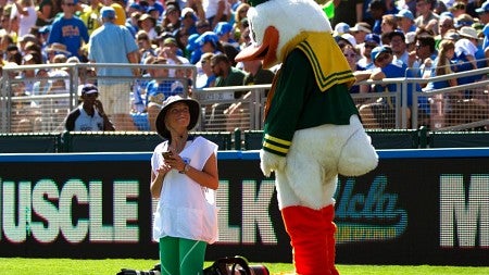 Taylor Wilder with University of Oregon duck on field