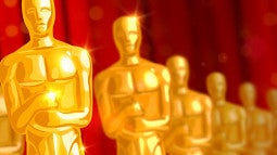 Digital illustration of a row of Oscar statuettes.