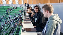 SOJC Track Bureau students report on a track meet at Hayward Field