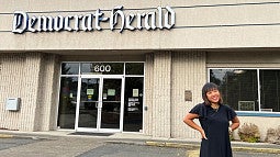 Kayla Nguyen in front of the Albany Democrat-Herald building