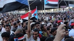 Protesters standing in a crowd in Aden, Al Mansoora during the Arab Spring 2011 (Credit: AlMahra under Creative Commons Attribution-Share Alike 4.0 International).