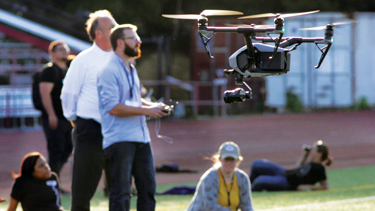 Students learning to fly drone. Students learning to fly drone.